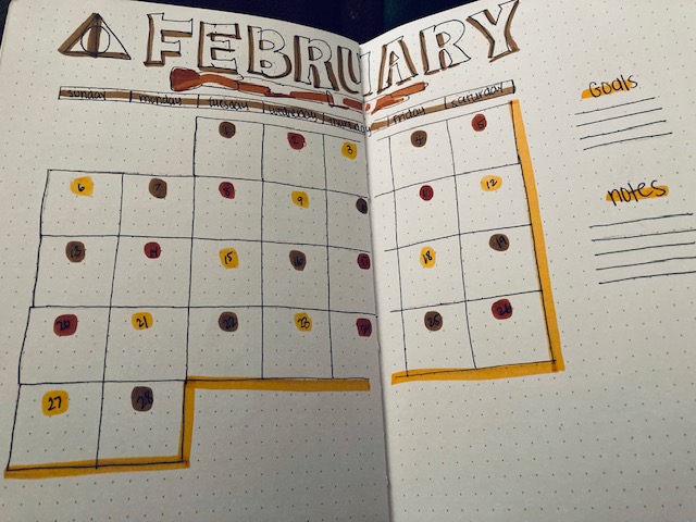 February 2022 calendar hand drawn with the sign of the horcrux and Griffyndor colors. 